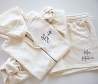 Gift Set for Bride or Bridal Party with Title, Name, Date - Bridal Shower or Bridal Proposal Gift - Zip Up Sweatshirt with Joggers or Shorts You can purchase the sweatshirt and shorts/joggers in 2 different sizes. You may add them to your cart separately or you may add the set option to your cart and note which sizes you need in the notes to seller section at checkout! Add Whatever you'd like to the zip up and the bottoms! Names or titles! Please message us with any questions, we'd be happy to help! ⋆｡o✩⋆｡o✩⋆｡o✩⋆｡o✩⋆｡o✩⋆｡o✩⋆｡o✩ FABRICATION FOR SWEATSHIRT ⋆｡o✩⋆｡o✩⋆｡o✩⋆｡o✩⋆｡o✩⋆｡o✩⋆｡o✩ RUNS BIG! Women's Sizing 7 oz./yd², 52/48 ringspun cotton/polyester blend 3-end fleece ⋆｡o✩⋆｡o✩⋆｡o✩⋆｡o✩⋆｡o✩⋆｡o✩⋆｡o✩ SHORTS INFO ⋆｡o✩⋆｡o✩⋆｡o✩⋆｡o✩⋆｡o✩⋆｡o✩⋆｡o✩ Independent Trading Company Brand Women's Sizing 7 oz