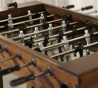 My brothers, friends and I have been playing foosball with my parents since we were in grade school. They bought a table at a garage sale for $15 and they still have it and we still huddle around it on the holidays - always a great time!