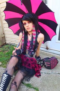 "I bleed pink.  -Gothic Umbrella.   -Black and Hot Pink.     -Batwing Edging.       -Black Metal Hardware. -For Rain and Shine!   -34\" L x 33.5\" D.      -J-Shaped Handle. -100% Nylon."