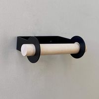 Made of a single piece of brass and a clean maple dowel this toilet paper holder has a simple design perfect for a variety of decors.