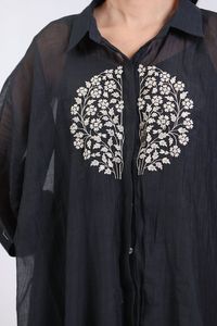 Black pure mul chanderi kaftan with placed floral vine embroidery highlighted with hand tucked moti and sequins. Comes with pure cotton satin wide pant and an inner slip. - Aza Fashions