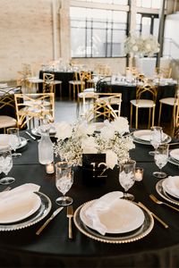 Step into Andrew and Sidney's modern black-tie affair at The Abbott in Kansas City, MO. From their elegant black and white decor with pops of gold, white roses, and babys breath, to the delectable dessert bar, and personalized details, this wedding is truly unforgettable.