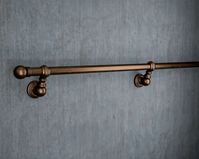 Welcome to Middle Farm Crafts UK! Our handcrafted ironmongery is made in Britain and comes with free delivery. We have 5 star reviews and are dedicated to excellent customer service, providing direct responses to questions within 1-12 hours. Add character and safety to your home with our industrial-style copper handrail. Made from metal with a Bronze paint finish, this vintage banister rail features a sleek steel rail, bold end caps, and striking industrial wall mountings. Handcrafted in our hom