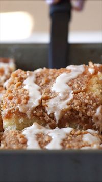 This Banana Crumb Cake Recipe is a moist and tender banana cake with layers of brown sugar crumb topping and a sweet icing drizzle. Perfect for a breakfast, brunch or weeknight dessert!