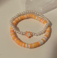 White, light orange, and orange clay bead bracelet White faux pearl and star charm bracelet