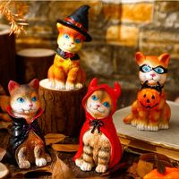 These calico cat figurines are wearing Halloween costumes and are ready to go trick or treating. #ad #halloween #cat #trickortreat