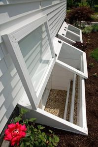 Window well cover idea: Redi-Exit Egress Systems' Two Deluxe Custom Wells With Custom Hinged Covers. Great idea for mini greenhouse too if you make the steps just a little wider.