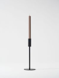 Our Tall Minimal Candle Holder in black is a classic, simple candle holder that still makes a statement. Ideal for candle-lovers in any modern, minimal home. Dimensions: The Tall Minimal Candle Holder is 24cm tall. The outline circle base is 9cm wide. It will fit candles that are 2cm wide or less.