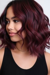 Midnight sangria curls are inspired by the rich, dark red of sangria. Perfect for night-outs, this color adds a touch of mysterious allure to your curly locks. Click here to check out more stunning dark red hair color ideas for 2023.