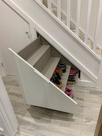 Under the stairs shoe rack. Pull out storage