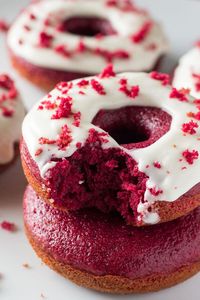 Baked Red Velvet Doughnuts. These moist doughnuts have the perfect cake doughnut crumb, a delicious red velvet flavor & a cream cheese glaze. www.justsotasty.com