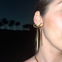 Make any dinner outfit effortlessly elegant with our Date Night Bow Waterproof Earrings made of beautiful gold snake chain! These adorable, asymmetrical bow dangle earrings feature waterproof 18K Gold PVD Plated Stainless Steel.