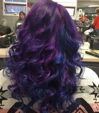 Dark purple/blue hair dyed and curled at Vixen