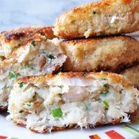 A homemade fishcake cut in half to show the inside.