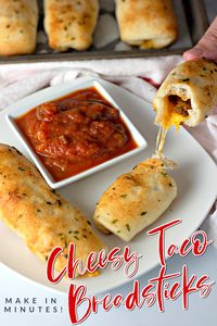 What's for dinner? These delicious Cheesy Taco Sticks! You'll love how easy it is to make soft, buttery breadsticks stuffed with taco meat and cheese. Dip them in salsa, sour cream, and guacamole for a super yummy dinner, lunch, or after school snack.