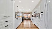 This galley kitchen is not only full of storage space, but is designed for functionality! Having the appliances across form eachother makes cooking easy! #kitchen #galleykitchen #whitekitchencabinets #newkitchen #homerenovation #remodel