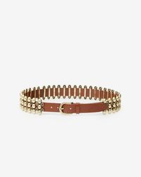 Elaborate belt in soft leather and metal Adjustable with a buckle Leather loop Round convex metal details Metal set with faux stones Gold-finish metal details Width: 3 cm / 1.2 in.