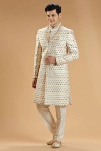 An amazing cream silk sherwani with embroidery, resham and sequins work design will enhance your elegance and make you the star of any occasion. It features a mandarin collar, a full button placket, full sleeves, and a straight vented hem. It comes with a bottom. Accessories is just only for photoshoot purposes.