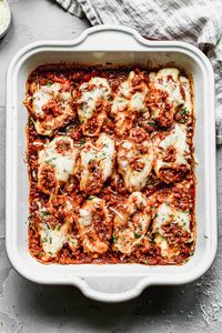 These Stuffed Shells an easy weeknight dinner perfect for feeding a crowd! Double the recipe for an extra freezer meal, making it an ideal solution for busy nights. Our stuffed shells have ground beef and sausage, as well as cheese filling.