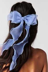 Forever femme and so chic, this classic hair bow is featured in a delicate, sheer fabrication with long flowing tails for the perfect dainty detail for any hairdo. | Lady Bow by Free People in Blue