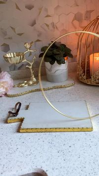 Difficulty: Easy     Supplies   • Gold hoops   • Coasters   • Glue