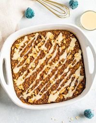 This gingerbread baked oatmeal makes for a cozy breakfast with warm spices and molasses. It's super easy to whip up, gluten-free and vegan. #gingerbreadoatmeal #bakedoatmeal #gingerbread #eatingbirdfood