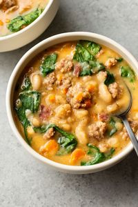 This flavorful Italian sausage white bean soup recipe is loaded with bacon and sausage, fresh spinach, and tender cannellini beans. It's simple to make and so cozy!