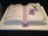 Open Book Wedding Cake with lilac sugar rose . Created in half fruit and half lemon sponge .