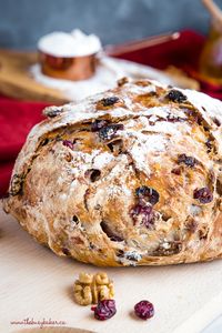 This No-Knead Cranberry Walnut Bread with Honey is a delicious sweet bakery-style bread that's perfect for the holidays! Make it perfect with my easy pro tips for homemade bakery-style bread! Recipe from thebusybaker.ca! #artisanbread #cramberry #honey #walnut #holiday #holidays #bread #easy #recipe #comfortfood #bakerstyle #homemade