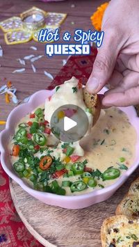 @nehadeepakshah on Instagram: "Hot & Spicy Quesso Dip ! Quesso in Spanish means cheese & this one is a winner ! 

You got to make this today because it is mind blowing

2 tsp Butter
1 Spring Onion Stalk
3 to 4 Cloves of Garlic
1/3 cup Bell Peppers

1 tbsp Butter
1 & 1/2 tbsp Whole Wheat Flour
1 cup Milk
Salt, Pepper , Chilli Flakes
1/3 cup Grated Cheese + some mozzarella cheese
1 tsp Spicy Chilli Powder
1/2 tsp Cumin Powder
1 tbsp chopped jalapeños
1/2 tsp Black Pepper

Some bell peppers, spring onion & chillies for topping

Some bread or crackers for serving

🌟 Vishesh Tippani
-  you can make this ahead & Serve it HOT
- If it thickens, add a little milk to adjust the consistency

#CheeseDip #Quesso #SpicyQuesso #DiwaliRecipesWithNDS #PartyPleasersWithNDS"