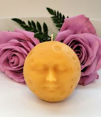 "Our new Calm Moon candle!  We named this new addition to our candle selection Calm Moon candle because it is a moon with a sweet calming face on it and looks peaceful.  Like all our candles, it is made from 100% locally sourced beeswax from Washington apiaries.  I measures 3\"tall, 2.5\"wide and weighs 4.350z.  A great gift for moon or space lovers!"