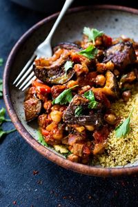 Delicious, Healthy Tagine Recipe with Eggplant and Chickpeas- seasoned with Moroccan spices and served over couscous. A simple plant-based dinner recipe! #tagine