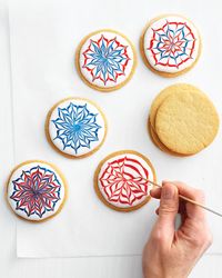 Tools and Materials      * Royal Icing in White, Red, and Blue      * Plastic squeeze bottles or pastry bags      * Fireworks Cookies      * Toothpicks or skewers       1.        Fireworks Cookie How-To     2. Place each colored icing in a separate plastic squeeze bottle; cut a small hole at the tip for w...