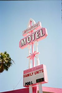 Pastel pink mid century modern hotel signage