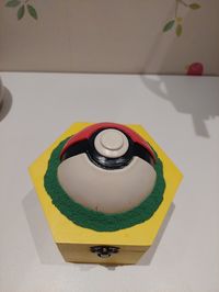 wooden box from the works decorated with half polystyrene ball, crayola model magic airdry clay coated with a pva and water mixture to strengthen