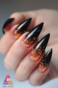 Black nails with glittery orange tips, ideal for October nails and fall. Get this chic and simple look at NailHow.com and shine this fall! 🍂🧡🖤 #OctoberNails #FallNailDesigns #FallNailColors