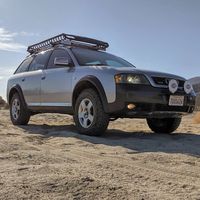 Lifted Audi Allroad C5 with all terrain tires and a roof rack. Find more cool Audi off-road builds and overland projects on Offroadium!