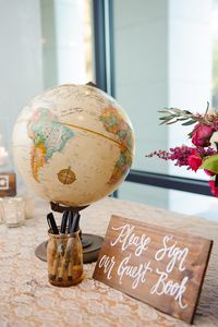 World Globe Guest Book Display    Photography: Sarah %26 Ben   Read More:  http://www.insideweddings.com/weddings/florida-wedding-celebration-with-vibrant-colors-and-wooden-details/644/