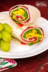 This Zesty Italian Wrap is loaded with ham, salami, and pepperoni. Perfect for packing in a lunch box for school, or in a cooler for picnics or camping. #lunchrecipe #lunchboxrecipe #lunch #wraprecipe #lunchwrap #Italianwrap #Italiansandwich #FavoriteFamilyRecipes #favfamilyrecipes #FavoriteRecipes #FamilyRecipes #recipes #recipe #food #cooking #HomeMade #RecipeIdeas