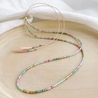 A delicate silk necklace with pink, greens and gold glass beads which has a gold sliding clasp to adjust to your size. The Islamorada  slider necklace is inspired by the tropical pinks and greens of the beautiful Islamorada Florida Key and adds a pop of colour to your neck. This necklace measures 26in at it's longest (pulls on over the head) and has a gold filled sliding bead so you can shorten it to 16in. ( the picture on the model shows another colour option of the necklace at 16in and is for size reference only). Super lightweight and comfy to wear and is perfect for layering with other necklaces. Comes displayed in one of our pretty gift boxes, so fantastic as a present for a friend or to yourself! Matching bracelet at https://www.etsy.com/uk/listing/1060253750/pink-green-gold-beaded-b