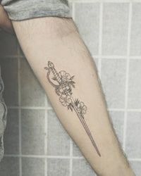 Inigo Montoya's sword surrounded by Buttercup flowers [Michelle @ White Rabbit Tattoo, NYC]