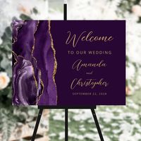 This elegant modern wedding welcome sign features a purple watercolor agate border trimmed with gold faux glitter. Easily customize the gold-colored text, with the couple's names in stylish handwriting script and the remaining text in sans serif font, on a deep purple background. (If you would like this sign in a different size, please be sure to avoid choosing any of the other "standard sizes," which may distort the design. Instead, scroll down to the "Choose your own size" option, and leave the "link" icon on so that the proportion of height and width remain the same.)