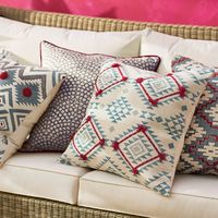 Yuma Cushion Cover, Large - Blue/Red by Oka. Accessorise your living room or bedroom with a selection of luxury OKA cushions, available in a wide selection of colours, sizes, patterns and fabrics including linen, cotton velvet, cotton, natural jute and tussah silk. OKA decorative cushion covers feature exclusive print designs and detailed hand-embroidered motifs. TheHouseDirectory.com, your sourcing destination.