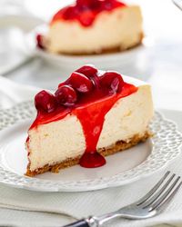 This Cheesecake Recipe is the only recipe you'll ever need for Cheesecake. A dreamy, decadent, rich, smooth and utterly delicious cheesecake topped with cherry topping! This really is what cheesecake dreams are made of! #cheesecake #recipe