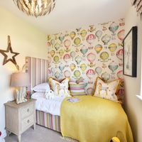 Why stop at just multi-coloured parachute wallpaper for your kids bedroom. Go one step further and brighten the room with colourful cushions and throw – We love this look at our 4 bedroom showhome at Princes Chase