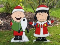 Charlie Brown Snoopy and Lucy Christmas Yard Art Charlie Snoopy and Lucy are each 3 feet tall **All of my Yard Art is made out of 1/2 inch MDO sign board. This is a special product that is specifically made for outdoor use. It is more expensive than plywood but will easily withstand