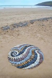 Artist surprises beach goers by leaving striking stone arrangements along the coast