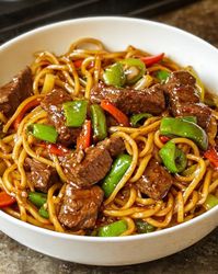 Savor this quick Beef Stir Fry with Noodles drenched in a savory sticky sauce. Perfect for busy weeknights! 🍜 #QuickMeals #BeefStirFry #AsianCuisine #NoodleLover #EasyDinner