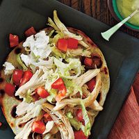 These chicken tostadas are quick and easy to make and are especially great when topped with a creamy, homemade avocado and sour cream dressing.