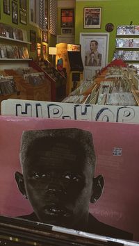 Pink vinyl LP of Tyler the Creator's studio album, IGOR at Pinwheel Records in Pilsen, Chicago. — record shopping, record store aesthetic, vintage, record shop, retro, pacman machine, arcade, retro vibes, record player, grunge aesthetic, alternative record shop aesthetic, photo ideas, photo inspo, grainy, film photoshoot ideas, vinyl shopping, music store, old music store, beautiful music